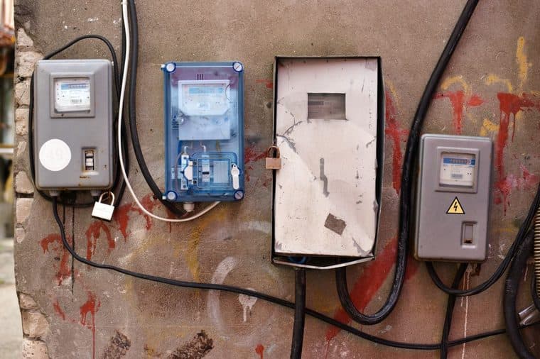 A row of household electricity meters on a wall
