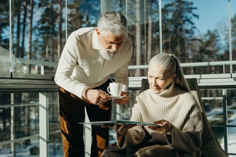 A retired couple relaxing at home