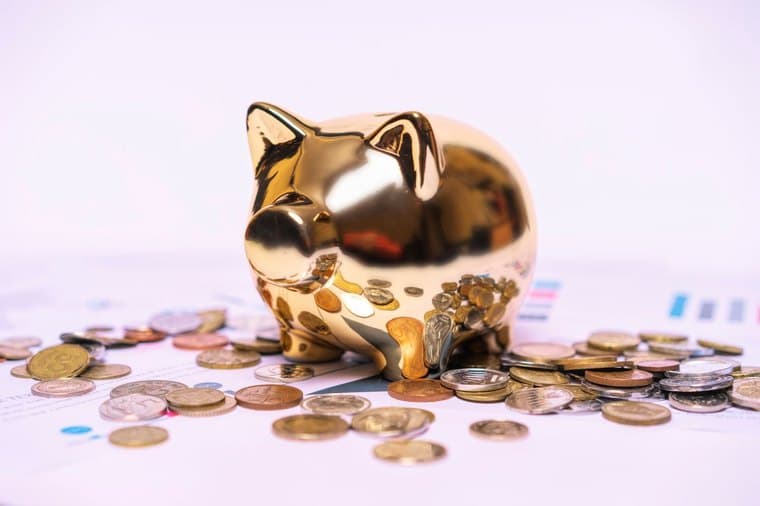 Piggy bank on financial documents, representing before-tax and after-tax super contributions