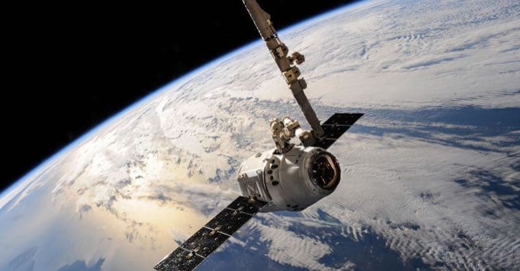 A large central planet orbited by smaller satellites, representing a broad core ETF surrounded by smaller satellite positions.