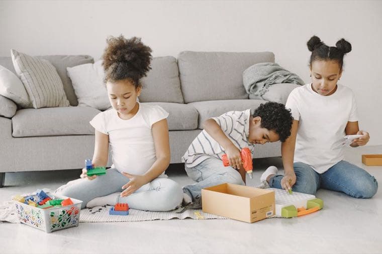 Parents and young children spending time together at home