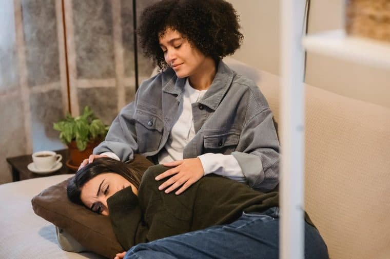 A person comforting another person during a difficult time