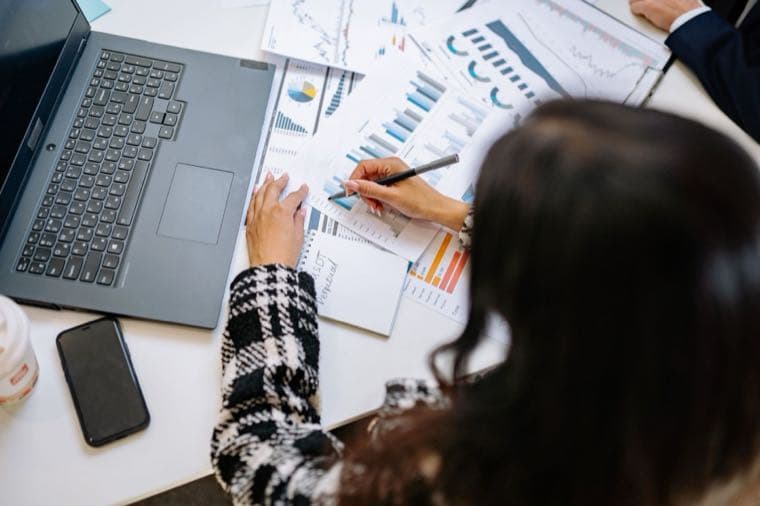 A professional reviewing financial charts, representing Division 293 tax for high earners