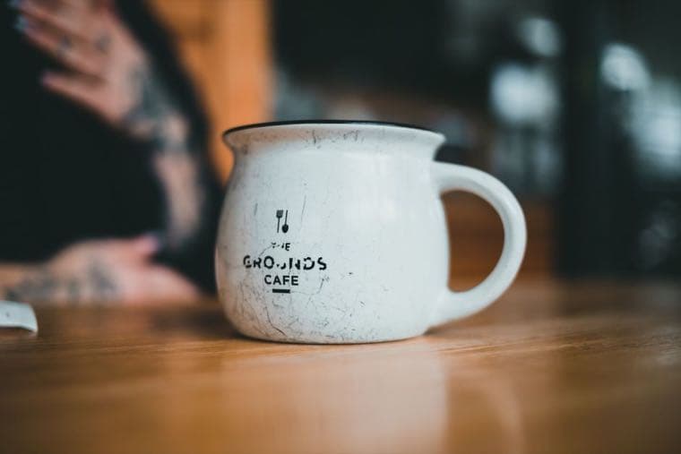 A single coffee mug on a table, the object used in the classic endowment effect study