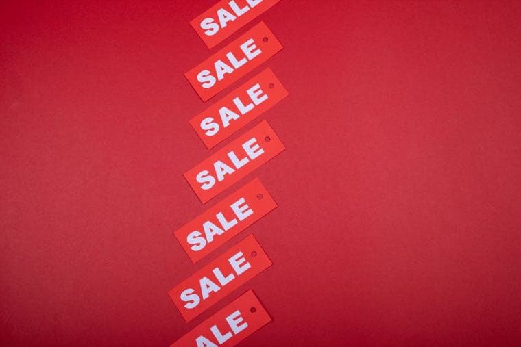 Price tags on a rack, illustrating how the same price can be framed differently