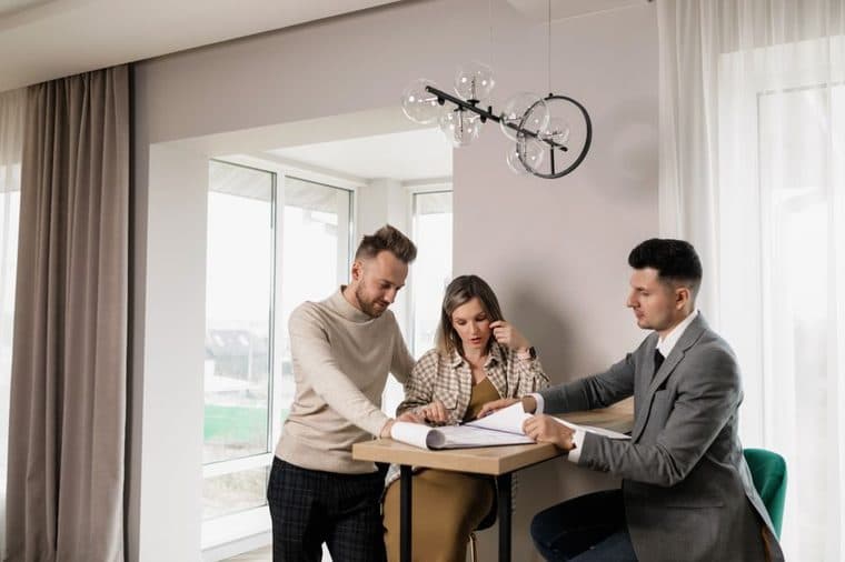 An older couple reviewing paperwork together at home