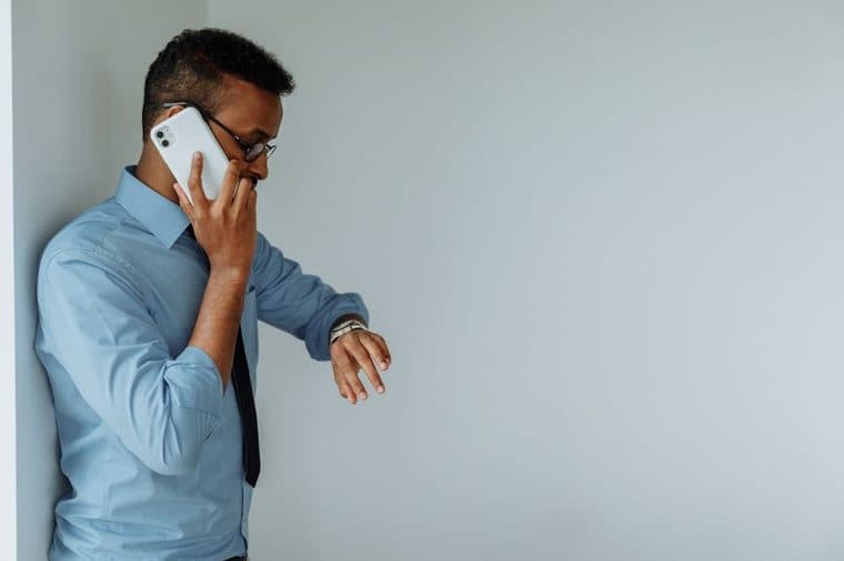 A person checking their phone while waiting