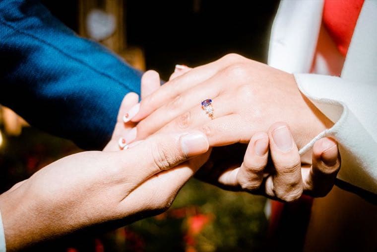 A person proposing with an engagement ring