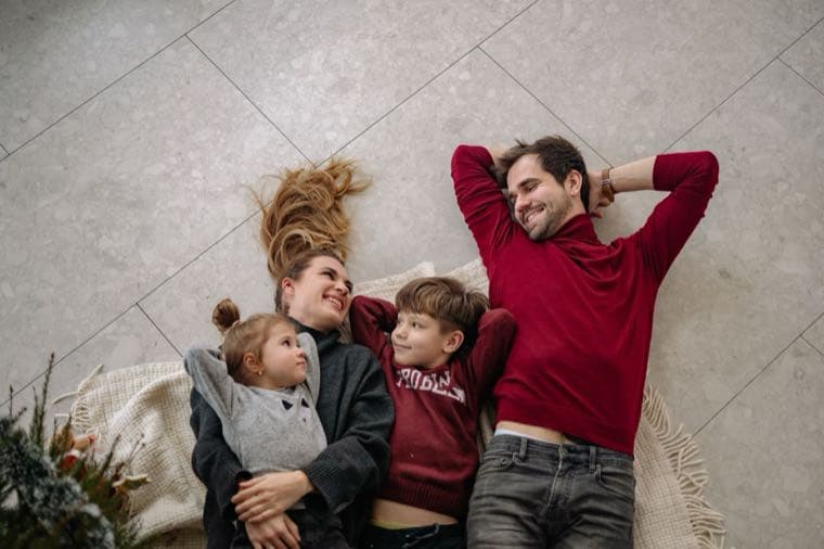 A family relaxing together at home, representing life insurance and protecting loved ones