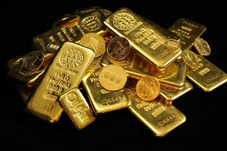 Gold bars and coins, representing gold investment