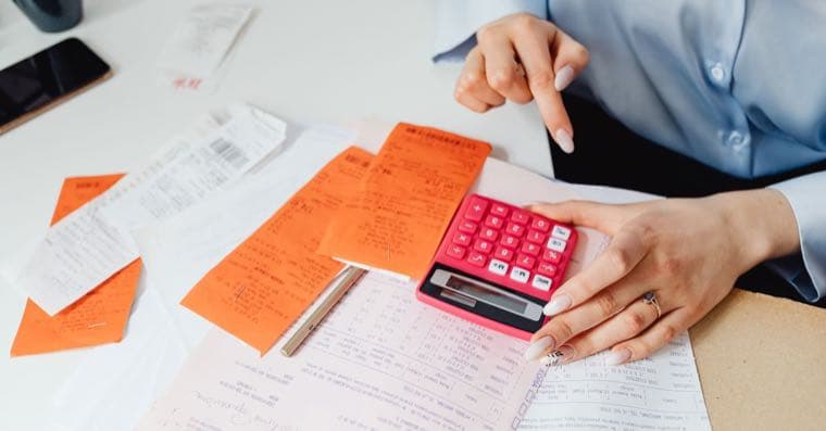 Receipts and a calculator on a desk