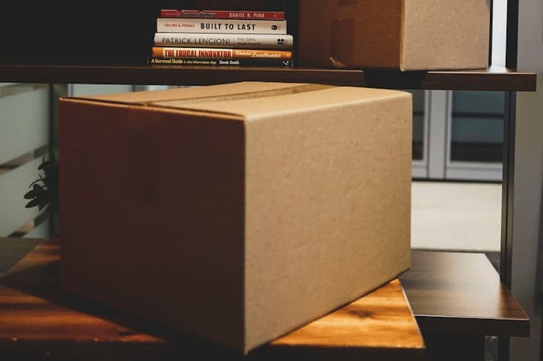 Cardboard boxes packed on a desk after leaving a job