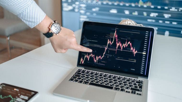 A laptop showing an index fund performance chart