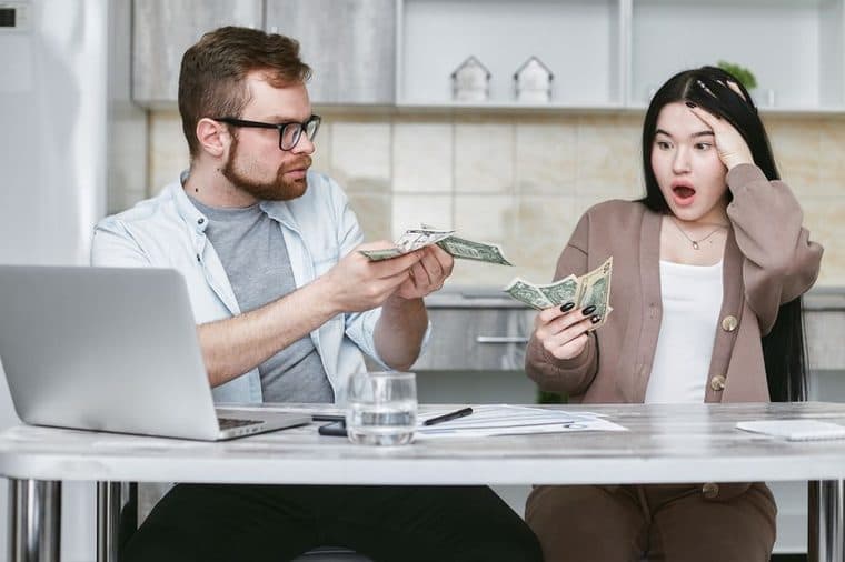 A couple reviewing their finances together at home