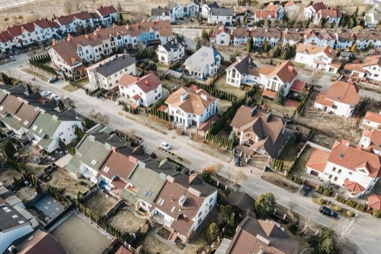 Aerial view of Australian suburban rooftops, representing land tax across the states
