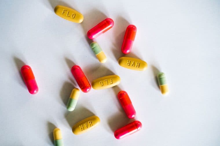 Colourful prescription medicines on a white surface