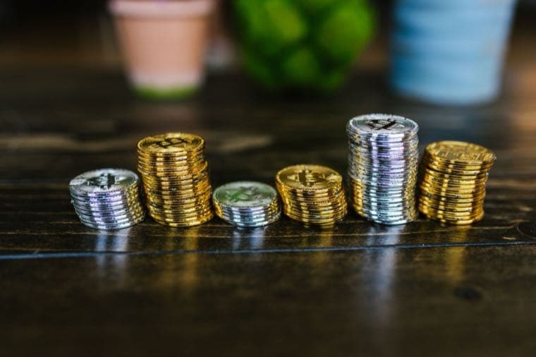 Stacks of coins growing over time, representing lump sum investing versus dollar-cost averaging