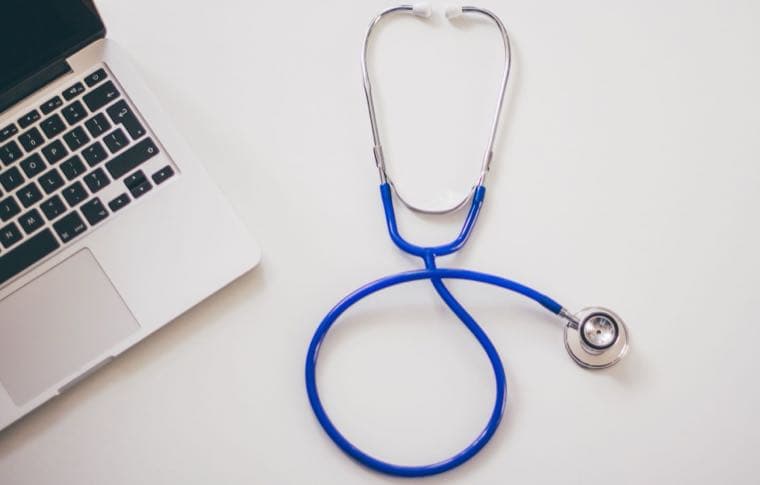 A stethoscope and laptop, representing the Medicare levy and its exemptions in Australia