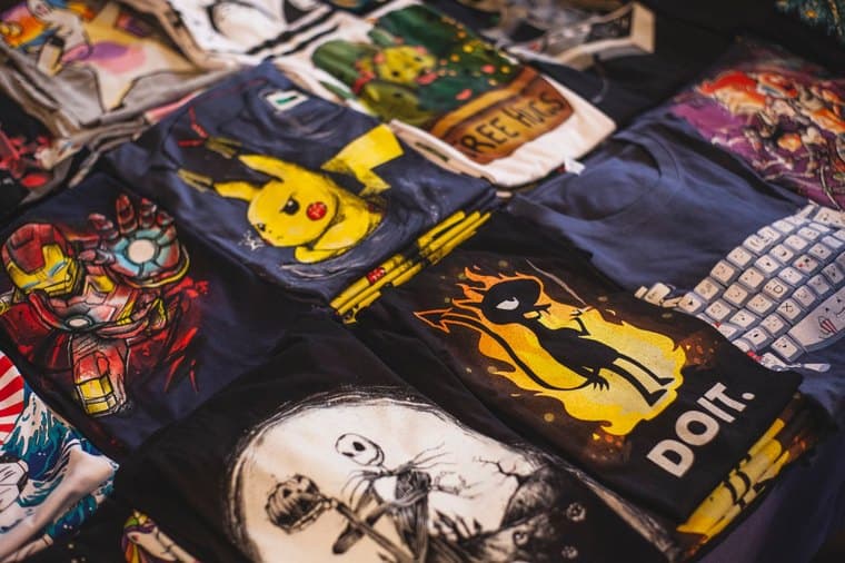 A rack of printed graphic t-shirts, representing a print-on-demand business
