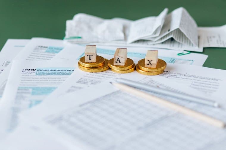 A sole trader sorting receipts and claiming business tax deductions