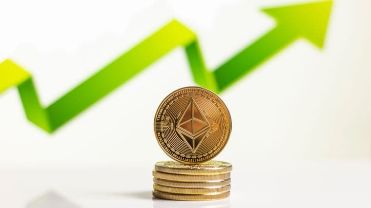 A stack of Ethereum coins in front of a green upward arrow