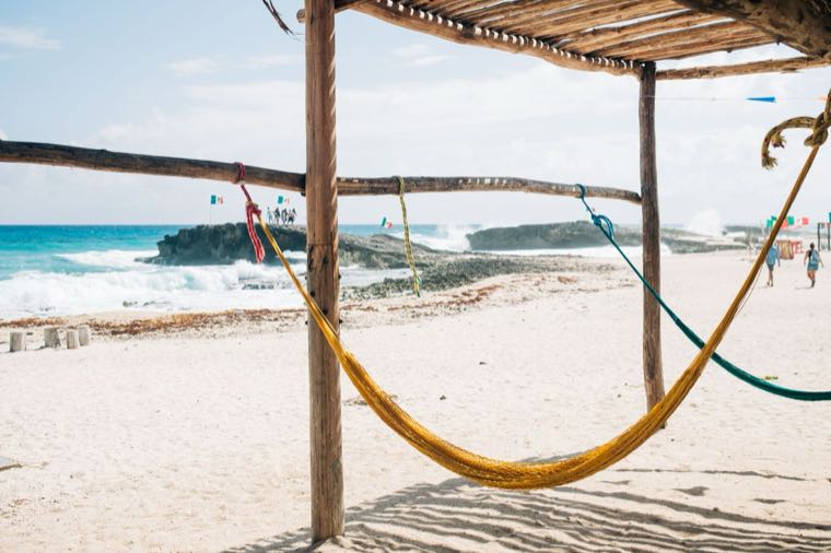 A hammock on a sunny Australian beach, representing paid annual leave