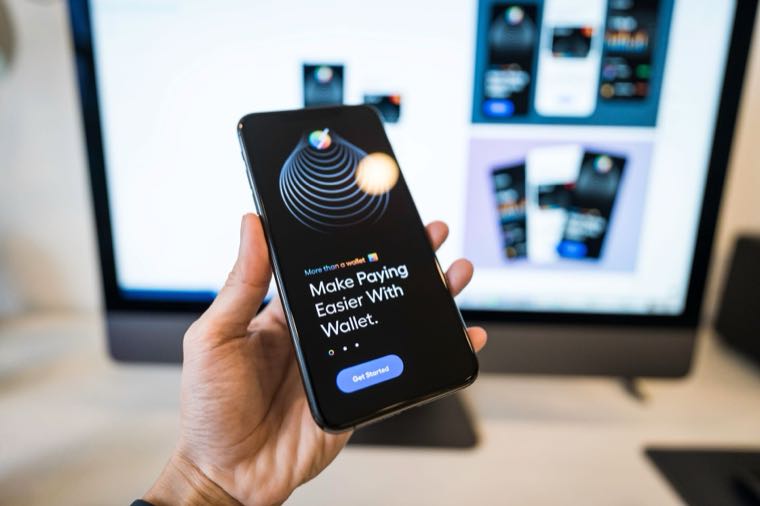 A smartphone showing a mobile banking app, representing comparing bank accounts in Australia