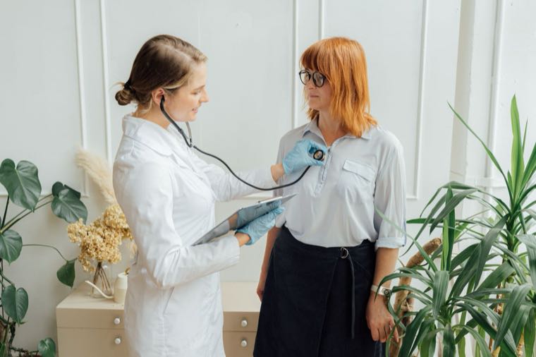 A doctor consulting a patient, representing private health insurance in Australia