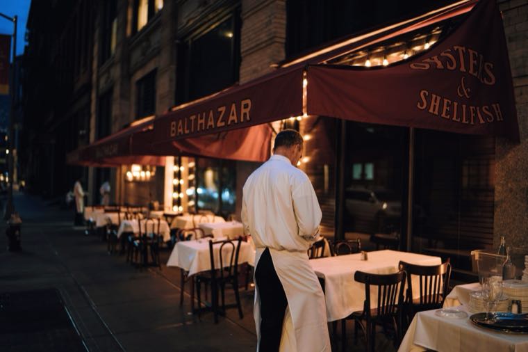 A waiter working an evening restaurant shift, representing penalty rates in Australia