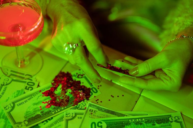 Hands holding a stack of cash, representing a work bonus in Australia