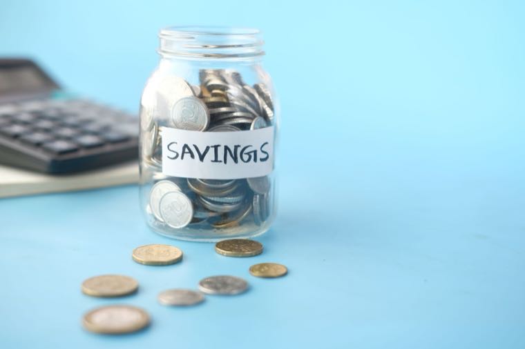 A savings jar of coins, representing term deposits and savings accounts in Australia